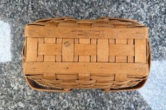 vintage 1993 Longaberger hand-woven handled basket with a clear plastic liner
