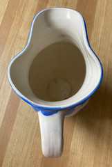 decorative ceramic pitcher. Blue/white zigzag pattern. 8.5″ tall. signed