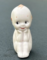 Kewpie Doll with Blue Wings Porcelain Sitting Figurine 2.25″- Unknown Marking