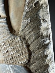 DETAILED ANCIENT N-EASTERN STONE FRAGMENT DEPICTING WINGED GENIE C 800-700 BC