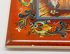 Suzanne Toftey 6″ Rosemaling Tile Trivet Lutefisk Boy Nordic Folk Art Norway
