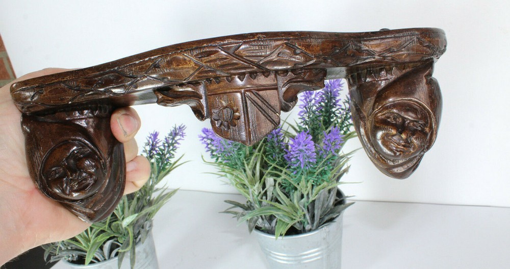 Miniature gothic heads ceramic wall console