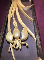 Two Wooden Multi-Toned Bas-Relief Floral Wall Hangings