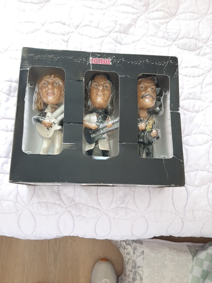 RUSH BOBBLEHEAD DOLLS 2002….IN ORIGINAL BOX….NEVER USED….