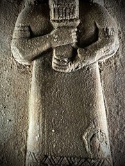 LARGE ASSYYRIAN STONE CARVED PLAQUE DEPICTING MALE RULER UNDER THE SUN AND STARS