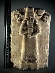 LARGE ASSYYRIAN STONE CARVED PLAQUE DEPICTING MALE RULER UNDER THE SUN AND STARS