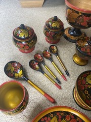 Collection of traditional Russian Khokhloma hand-painted wooden ware.