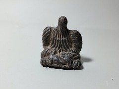 CIRCA NEAR EASTERN BLACK STONE SEATED BIRD.