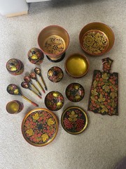 Collection of traditional Russian Khokhloma hand-painted wooden ware.
