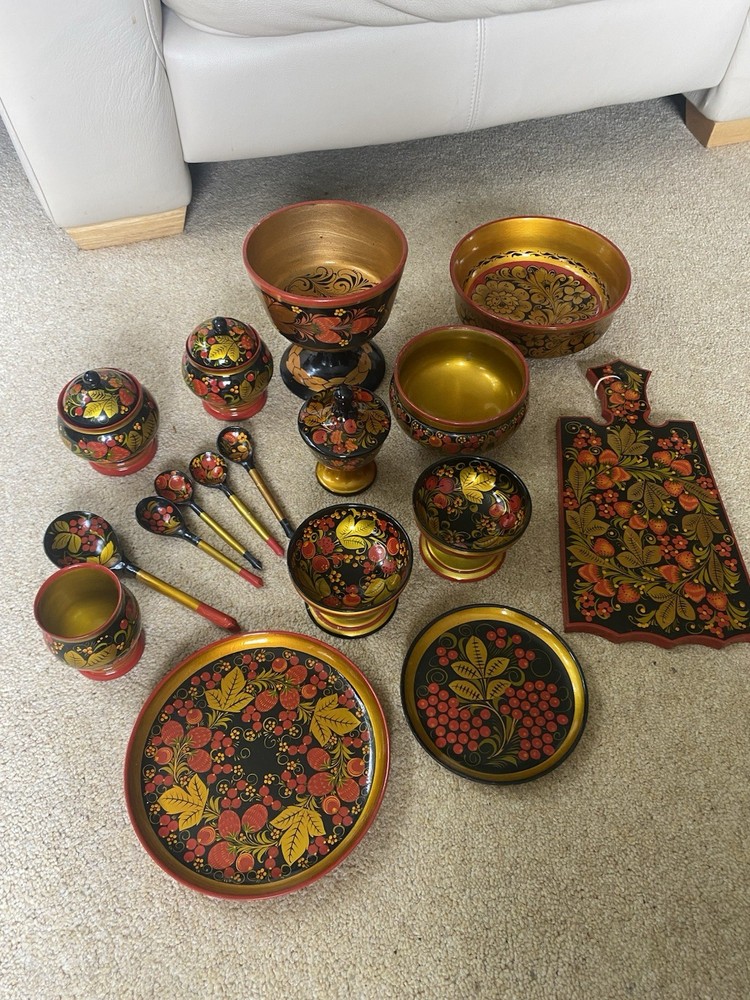 Collection of traditional Russian Khokhloma hand-painted wooden ware.