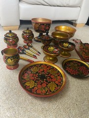 Collection of traditional Russian Khokhloma hand-painted wooden ware.