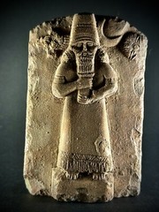LARGE ASSYYRIAN STONE CARVED PLAQUE DEPICTING MALE RULER UNDER THE SUN AND STARS