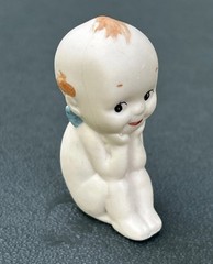Kewpie Doll with Blue Wings Porcelain Sitting Figurine 2.25″- Unknown Marking