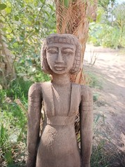 Ancient egyptian antique tall wooden female sculpture with carved hair and dress