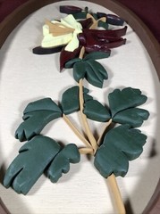Two Wooden Multi-Toned Bas-Relief Floral Wall Hangings