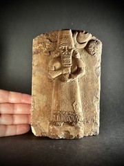 LARGE ASSYYRIAN STONE CARVED PLAQUE DEPICTING MALE RULER UNDER THE SUN AND STARS