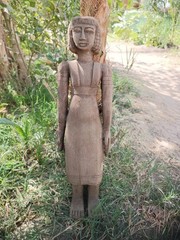 Ancient egyptian antique tall wooden female sculpture with carved hair and dress