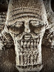 LARGE ASSYYRIAN STONE CARVED PLAQUE DEPICTING MALE RULER UNDER THE SUN AND STARS