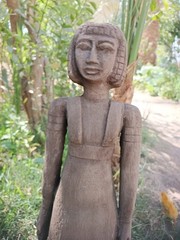 Ancient egyptian antique tall wooden female sculpture with carved hair and dress