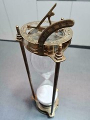 vintage maritime brass sand timer hourglass with sundial compass on top
