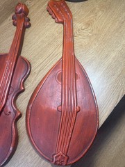 vintage Royal cast metal violin and mandolin set wall hanging, typically found i