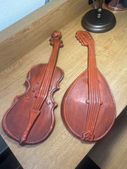 vintage Royal cast metal violin and mandolin set wall hanging, typically found i