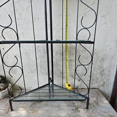Vintage 6′ Metal corner baker’s rack with scrollwork design and glass shelves