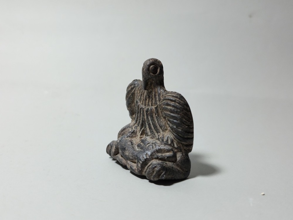 CIRCA NEAR EASTERN BLACK STONE SEATED BIRD.