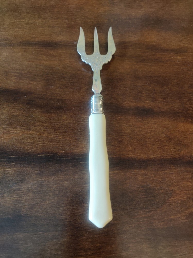 Antique 1913 Edwardian silver collared Trident searing fork