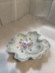 Artist signed porcelain leaf-shaped dish with hand-painted floral motifs