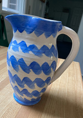 decorative ceramic pitcher. Blue/white zigzag pattern. 8.5″ tall. signed