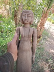 Ancient egyptian antique tall wooden female sculpture with carved hair and dress