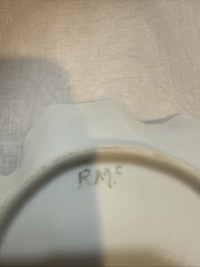 Artist signed porcelain leaf-shaped dish with hand-painted floral motifs