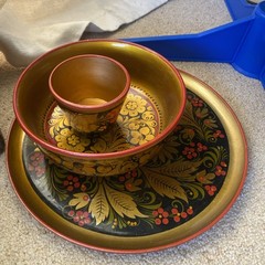 Collection of traditional Russian Khokhloma hand-painted wooden ware.