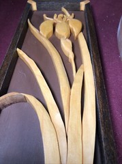 Two Wooden Multi-Toned Bas-Relief Floral Wall Hangings